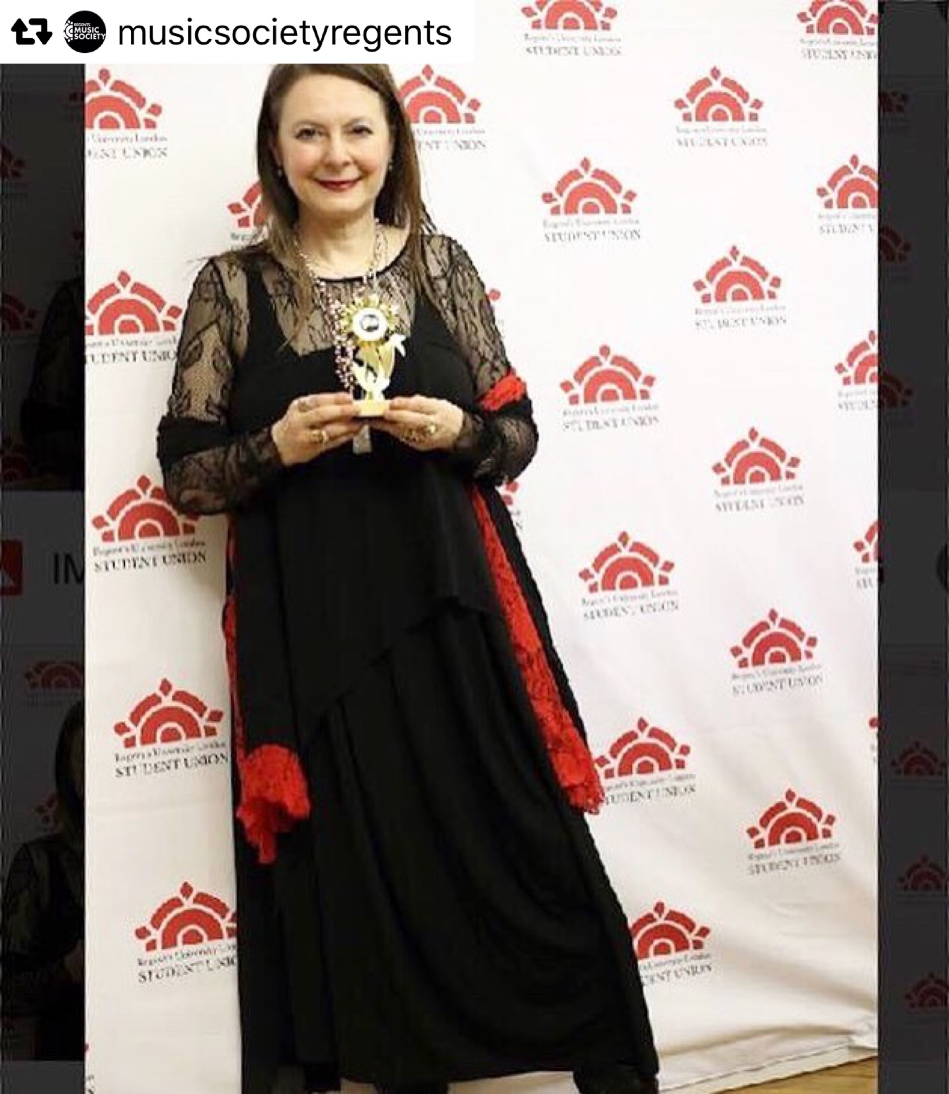 Olga Thomas holding her Best Classical Composer award