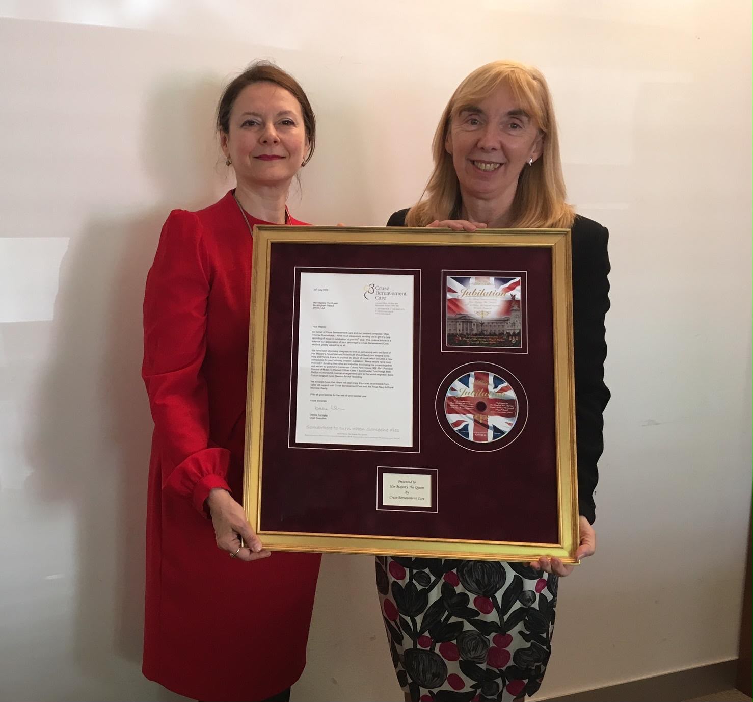 Olga Thomas with Debbie Kerslake and the framed Jubilation presentation