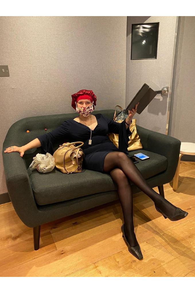Olga Thomas seated in a surgical hat and mask at The Old Hit Factory Studios