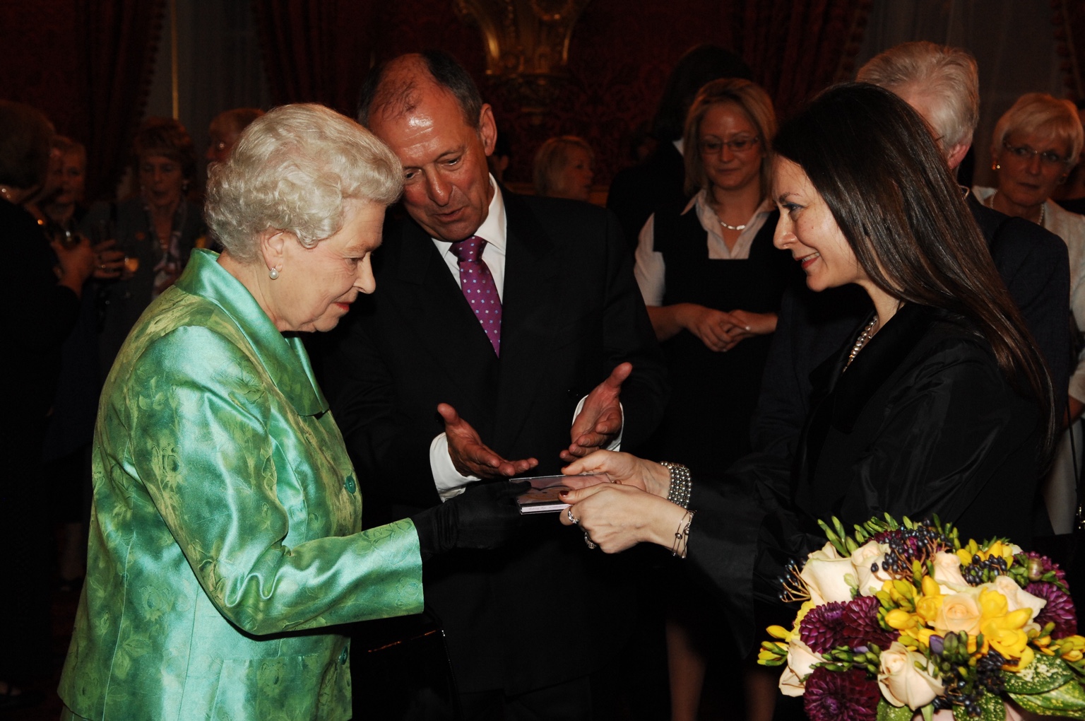 Olga Thomas presenting her music to Her Majesty Queen Elizabeth II
