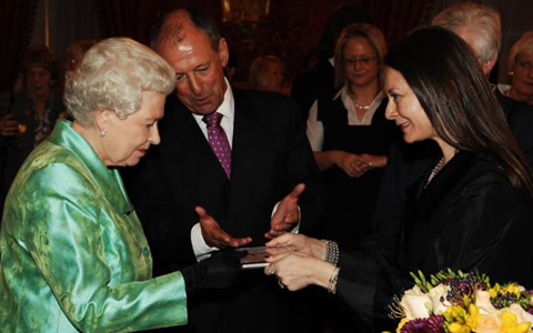 Olga Thomas presented to Her Majesty Queen Elizabeth II (photograph by Theodore Wood)