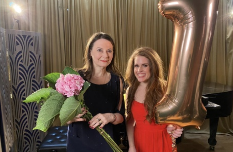 Olga Thomas with Joanna Forest holding a No. 1 balloon